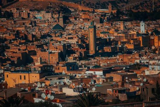 Panoramic rooftop view over the minarets and rooftops of Fes el-Bali medina